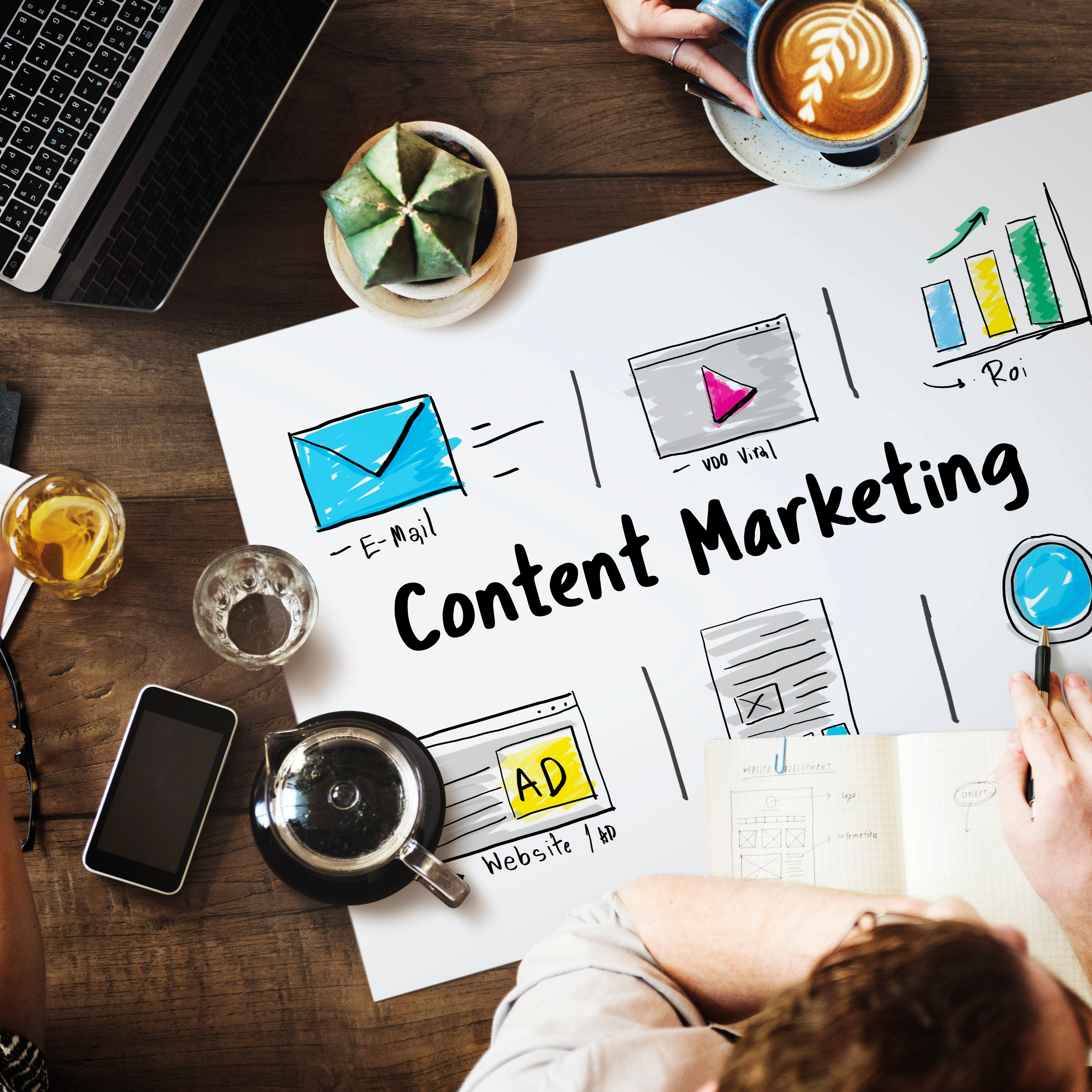 Workspace with digital marketing visuals labeled "Content Marketing," surrounded by icons and tools, representing a strategy session at a content marketing agency.